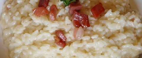 Risotto tomino, prosciutto e grappa